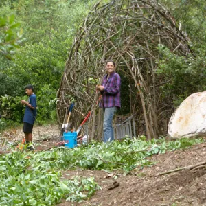 Volunteer and Betsy Lape working on the Woodrat House Casita