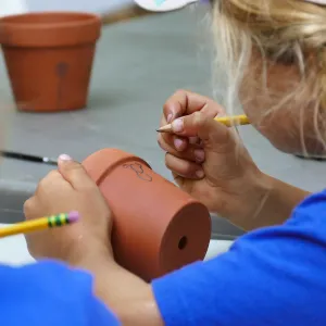 Acorn Adventurers Summer Camp, flower pot decorating activity
