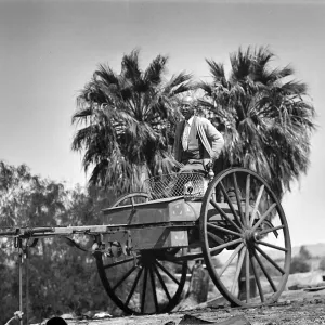 Thousand Palms, man in two-wheeled cart