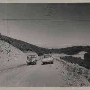 jeep and car on Sierra Madre Road, soon after construction