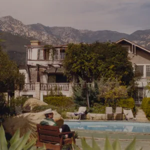 Clif sitting by pool at Gane House, Santa Barbara Botanic Garden