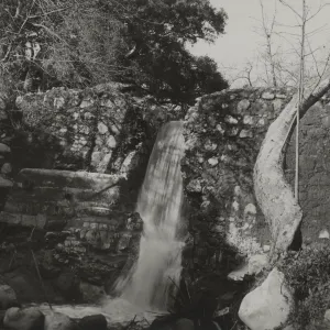 waterfall flowing over Mission Dam, circa 1920's