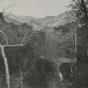view of Mission Dam and Mission Creek waterfall with mountains behind, circa 1942