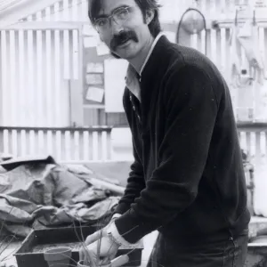 Volunteers - Garden Growers, Garden Grower Sean Hutchinson prepares for plant sale, repotting plants