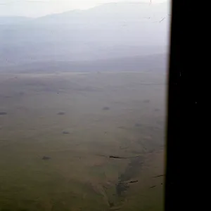 Santa Cruz Island from inside helicopter, rock piles, Gherini Ranch
