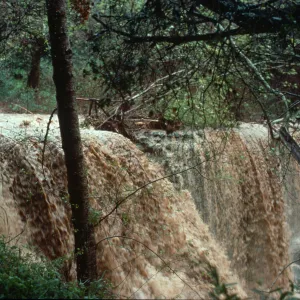 Torrential flooding of Mission Creek over Mission Dam