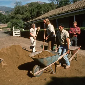 Adding new layer of decomposed granite to courtyard