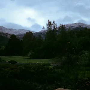 Early morning at garden, meadow, snow on Santa Ynez mountain range