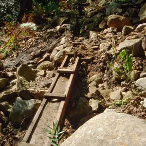 wooden aqueduct filled with silt after flood event, below Mission Dam