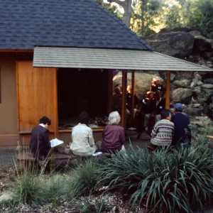 people surrounding tea house at event