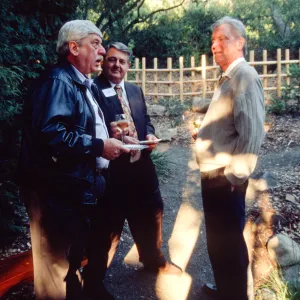 Ed Schneider with guests at tea house event