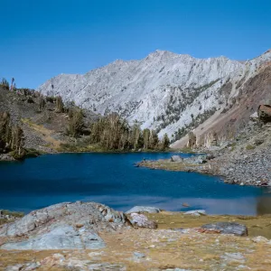lower Hoover Lake, 9900 ft, CHMuller fishing on point, Mono County, 9/27/1966
